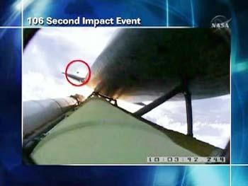 A NASA graphic shows an impact event believed responsible for damage along an area of about 21 inches (53 cm) spanning four of space shuttle Atlantis' thermal tiles in this image from NASA TV May 12, 2009. The Atlantis astronauts have uncovered a long stretch of nicks on their space shuttle, the result of launch debris. NASA says the damage does not appear to be serious. (Xinhua/Reuters Photo)