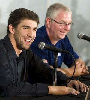 Swimmer Michael Phelps (L) answers questions as his personal coach Bob Bowman looks on during a news conference at the Mecklenburg Aquatic Center in Charlotte, North Carolina May 14, 2009 (Xinhua/Reuters Photo)