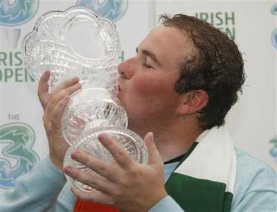 Ireland's amateur golfer Shane Lowry kisses the Irish Open Trophy after winning the Tournament, in Baltray, Ireland, Sunday, May, 17, 2009.(AP Photo/Peter Morrison) 