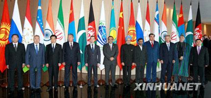 The leaders of Shanghai Cooperation Organization (SCO) member states and observer nations have a group photo taken with the leader of Afghanistan, a guest country of the SCO, in Yekaterinburg, Russia, on June 16, 2009. (Xinhua/Pang Xinglei)