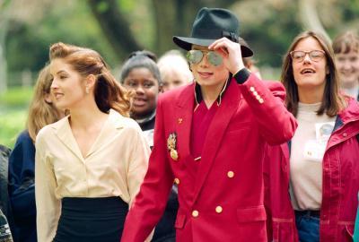 Michael Jackson and then wife Lisa Marie Presley are seen at Neverland Ranch in preparation of the Children's World Summit in April 1995. Presley would file for divorce less than a year later, prompting speculation about just what had inspired the relationship.