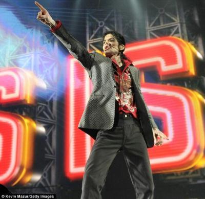 Putting on a thriller: Michael Jackso strikes a familiar pose as he practises his routine in the Staples Centre, LA,  for the This Is It comeback concerts