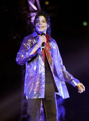 Pop star Michael Jackson rehearses for his planned shows in London at the Staples Center in Los Angeles, California in this handout photo taken June 23, 2009. (Xinhua/Reuters, File Photo)