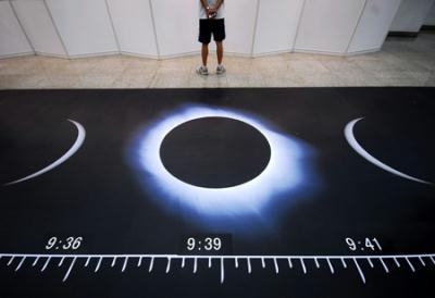 Photo taken on July 11, 2009 shows the sketch maps illustrating the whole process of the full solar eclipse during a popular science exhibition on the introduction to the forthcoming 2009 Full Solar Eclipse at the Shanghai Science & Technology Museum in Shanghai, east China. The upcoming full solar eclipse, predicted to betide on July 22 and believed to be the longest of its kind in 500 years, will be visible in most parts of the Shanghai Municipality.(Xinhua)