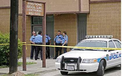 Los Angeles police detectives carry out a search at the office of Conrad Murray 