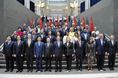 Chinese Vice Premier Wang Qishan (6th L, Front), State Councilor Dai Bingguo (5th L, Front), U.S. Secretary of State Hillary Clinton (5th R, Front), U.S. Treasury Secretary Timothy Geithner (4th R, Front) and other officials pose for a group photograph before the opening ceremony of the China-U.S. Strategic and Economic Dialogue (S&ED) in Washington, the United States, July 27, 2009. The China-U.S. Strategic and Economic Dialogue (S&ED), the first of its kind between the world's biggest developing country and biggest developed country, opened here on Monday. (Xinhua/Zhang Yan)