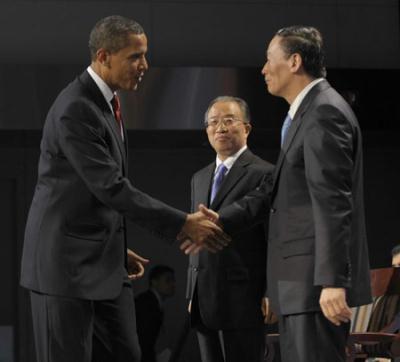 U.S. President Barack Obama (1st L) greets Chinese Vice Premier Wang Qishan (1st R) and State Councilor Dai Bingguo (Rear) before addressing the opening ceremony of the China-U.S. Strategic and Economic Dialogue (S&ED) in Washington, the United States, July 27, 2009. (Xinhua/Zhang Yan)