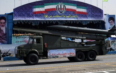 A missile truck is displayed during an annual military parade which marks the 29th anniversary of Iran's eight-year war with Iraq, in Tehran on Sept. 22, 2009. Iranian President Mahmoud Ahmadinejad warned that Iran would confront any attack on the Islamic republic on Tuesday. (Xinhua/Ahmad Halabisaz)