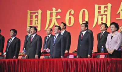 Li Changchun (C F), member of the Standing Committee of the Political Bureau of the Central Committee of the Communist Party of China, watches the performance by 122 choruses to mark the 60th anniversary of the founding of the People's Republic of China, in Beijing, capital of China, Sept. 25, 2009. (Xinhua Photo)