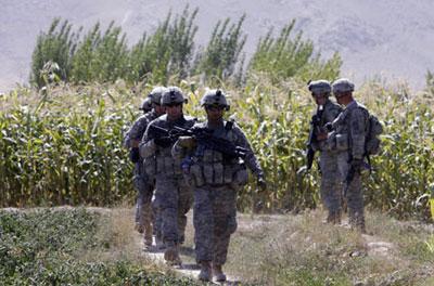 The U.S. Soldiers search for IEDs (improvised explosive device) laid by the Taliban near the village of Eber in Logar province September 26, 2009. (Xinhua/Reuters Photo)