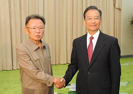 Chinese Premier Wen Jiabao (R) shakes hands with Kim Jong Il, top leader of the Democratic People's Republic of Korea (DPRK), during a meeting in Pyongyang, capital of the DPRK, Oct. 5, 2009.(Xinhua/Fan Rujun)