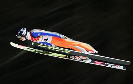 Pragelato, 17 February 2006, XX Olympic Winter Games. Ski jumping: Ski jumping: Simon AMMANN of Switzerland competes in the large hill individual qualifying. Credit: Getty Images/Clive Mason