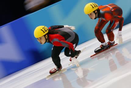 Salt Lake City, Salt Lake Ice Center, 23 February 2002: YANG (S) Yang of China, 3rd and Marie-Eve DROLET, 4th, compete in the women's 1000m short-track speed skating final during the XIX Olympic Winter Games. Credit: Getty Images/MIRALLE Donald