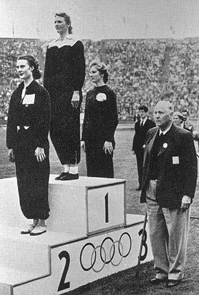 London, Wembley, 4 August 1948: medal ceremony for the 80m hurdles event: Francina BLANKERS-KOEN from Netherlands, 1st, Maureen GARDNER from Great Britain, 2nd, and Shirley STRICKLAND-DE LA HUNTY from Australia, 3rd. Credit: IOC Olympic Museum Collections