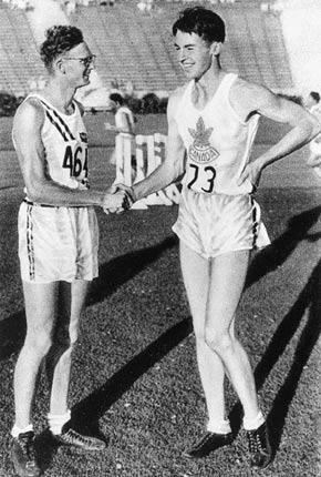 Los Angeles, 1932. Games of the X Olympiad. Men's athletics. American athlete Robert VAN OSDEL, 2nd, congratulates fellow rival and gold medallist winning high jumper Duncan McNAUGHTON of Canada. Credit: IOC Olympic Museum Collections