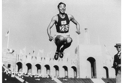 Los Angeles, Olympic Stadium, August 1932: Chuhei NAMBU of Japan, gold medallist, in action in the athletics triple jump event during the Games of the X Olympiad. Credit: IOC Olympic Museum Collections