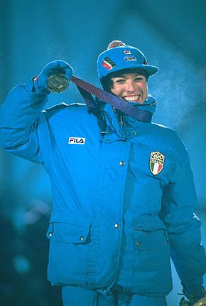 Lillehammer, 13 February 1994, XVII Olympic Winter Games. Cross country skiing, medal ceremony for the women's 15km free event: Manuela DI CENTA displays her gold medal with a beaming smile. Credit: Getty Images/BRUNSKILL Clive