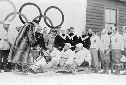 Lake Placid February 1932. General view of the award ceremony for the four-man bobsleigh event at the III Olympic Winter Games. The victorious USA I team members (William FISKE, Edward EAGAN, Clifford GRAY and Jay O'BRIEN) receive a trophy. Credit: Getty Images/IOC Olympic Museum Collections