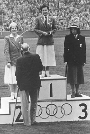 London, August 1948, Games of the XIV Olympiad: medal ceremony for the women's foil event: Ilona ELEK of Hungary, gold, Karen Vilhelmine LACHMANN of Denmark, silver, and Ellen PREIS-MÜLLER of Austria, bronze. Credit: IOC Olympic Museum Collections/Lothar R徂belt