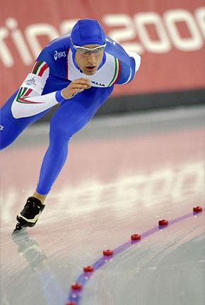 Turin, 11 February 2006, XX Olympic Winter Games. Italian Enrico FABRIS, future bronze medalist, performs in the 5000m speed skating final event at the Oval Lingotto. Credit : IOC/Yo Nagaya