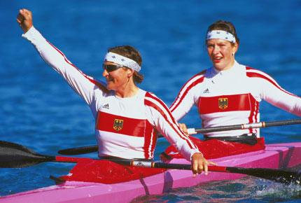 Sydney, 1 October 2000, Games of the XXVII Olympiad. Birgit FISCHER and Katrin WAGNER of Germany celebrate their gold medal win in the canoe-kayak K2 500m doubles final at the Regatta Centre. Credit : Getty Images/Darren England