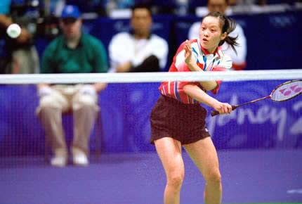 Sydney, Olympic Park, Pavilion 3, 20 September 2000, Games of the XXVII Olympiad: Jun GU of China in action in the women's badminton doubles quarterfinals against Indonesia. Jun GU and her teammate Fei GE went on to win the gold medal. Credit: Getty Images/Robert Cianflone