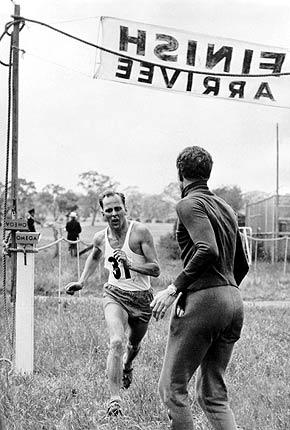 Melbourne, 28 November 1956: Lars HALL from Sweden, winner of the modern pentathlon, at the finish line of the running portion of the event during the Games of the XVI Olympiad. Credit: IOC Olympic Museum Collections/JAY Harry