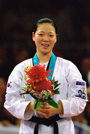 Sydney, Sports centre, Olympic Park, 29 September 2000, Games of the XXVII Olympiad: medal ceremony for the -67kg taekwondo event: Sun-Hee LEE of Korea, gold. Credit: Getty Images/Billy Stickland