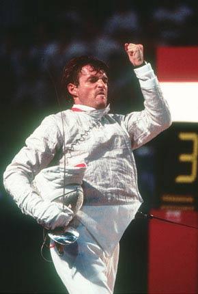 Barcelona, Palau de la Metal Lurgia, 2 August 1992: Marco Marin of Italy celebrates his silver medal performance in the individual sabre event during the Games of the XXV Olympiad. Credit: Getty Images/Vandystadt/Yann GUICHAOUA