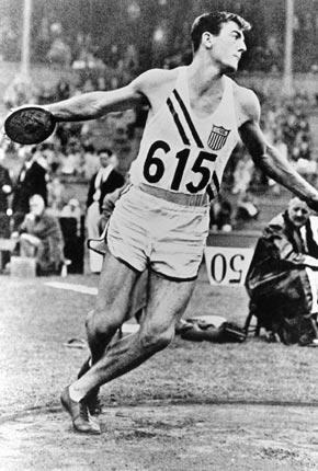 London, August 1948, Games of the XIV Olympiad. Men's athletics, decathlon: eventual winner Robert MATHIAS of the United States throwing the discus. Credit: Getty Images