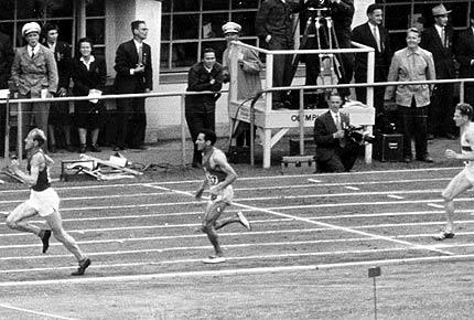 Helsinki 1952, Games of the XV Olympiade. Men's athletics, 5000m: Emil ZATOPEK of Czechoslovakia in front of Alain MIMOUN O'KACHA of France and Herbert SCHADE of Germany. t: IOC Olympic Museum Collections/RÜBELT Lothar