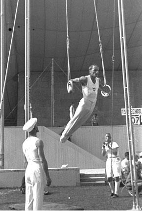 Berlin, Dietrich Eckart Open-Air Theatre, August 1936, Games of the XI Olympiad: the Swiss gymnast Georges MIEZ in action on the rings. Credit: IOC Olympic Museum Collections