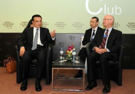 Chinese Vice Premier Li Keqiang (L front) meets with Klaus Schwab, founder and executive chairman of the World Economic Forum (WEF), in Davos, Switzerland, Jan. 28, 2010. (Xinhua/Xie Huanchi)