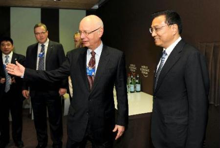 Chinese Vice Premier Li Keqiang (1st R) meets with Klaus Schwab (2nd R), founder and executive chairman of the World Economic Forum (WEF), in Davos, Switzerland, Jan. 28, 2010. (Xinhua/Xie Huanchi)