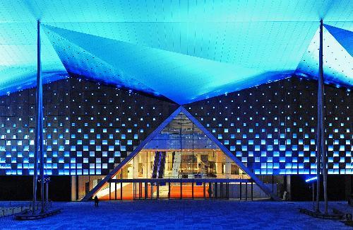 Photo taken on March 7, 2010 shows the illuminated theme pavilion at Shanghai Expo park during the light debugging, in Shanghai, east China. (Xinhua/Guo Changyao)