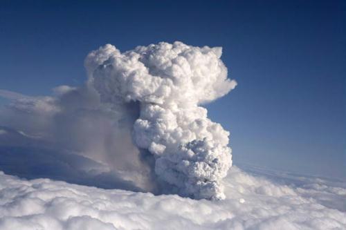 Smoke billows from a volcano in Eyjafjallajokull April 14, 2010. A volcanic eruption in Iceland spewed black smoke and white steam into the air on Wednesday and partly melted a glacier, setting off a major flood that threatened to damage roads and bridges. (Xinhua/Reuters Photo)