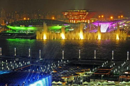 Photo taken on April 17, 2010 shows a group of permanent pavilions irradiated by the nearby music water curtain in a trial operation at the Shanghai EXPO park in Shanghai, China. (Xinhua/Guo Changyao)