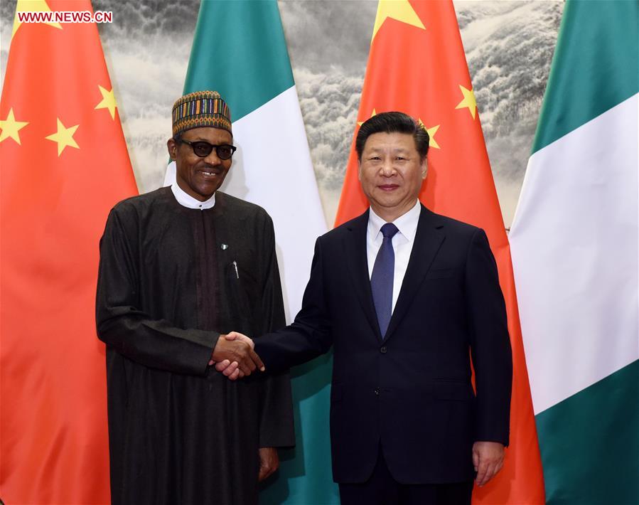 BEIJING, April 12, 2016 (Xinhua) -- Chinese President Xi Jinping (R) holds talks with Nigerian President Muhammadu Buhari in Beijing, capital of China, April 12, 2016. (Xinhua/Rao Aimin)  