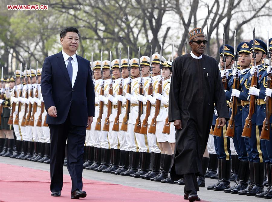 BEIJING, April 12, 2016 (Xinhua) -- Chinese President Xi Jinping (L) holds a welcoming ceremony for Nigerian President Muhammadu Buhari before their talks in Beijing, capital of China, April 12, 2016. (Xinhua/Ding Lin)  