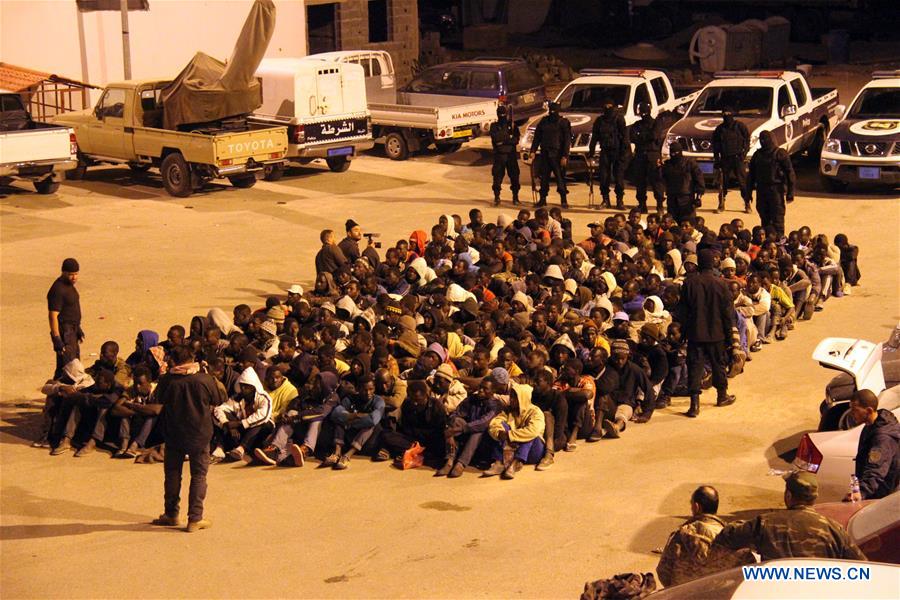  Illegal migrants, who wanted to cross the Mediterranean to Europe, are detained by Libyan security forces during a raid in Tripoli, Libya, early April 17, 2016. (Xinhua/Hamza Turkia) 