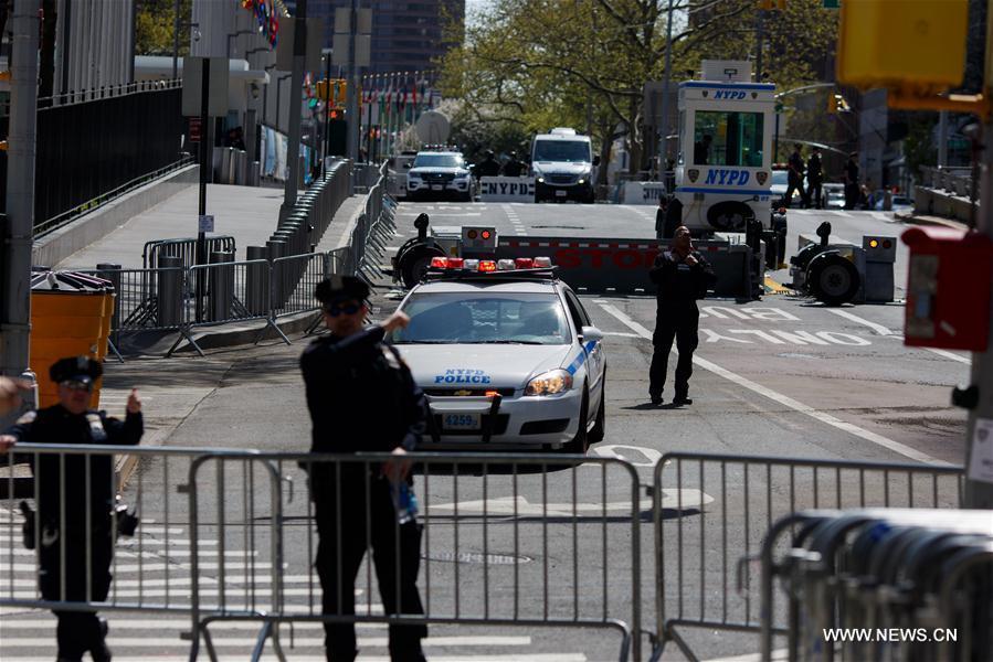 NYPD police officers and Secret Service agents stand guard outside theUnited Nationsheadquarters in New York, April 21, 2016. More than 165 UN member states are expected to attend a high-level signing ceremony for Paris climate agreement, including an estimated 60 heads of states and heads of governments, a UN spokesman told reporters here Thursday. 