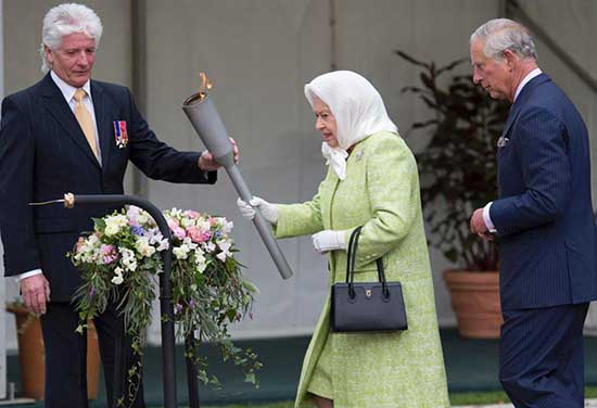 Pageantmaster Bruno Peek (L) hands Britain