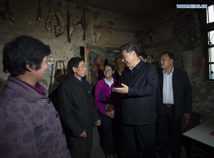 Chinese President Xi Jinping visits the family of villager Chen Zeping in Dawan Village of Huashi Township in Jinzhai County, Liuan City, east China