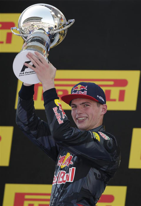 Max Verstappen lifts the trophy after winning the formula one Spanish Grand Prix on May 15, 2016. [Photo: Xinhua/AP]