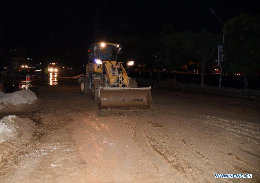 MAOMING, May 22, 2016 (Xinhua) -- An excavator works to clear silts in Xinyi, south China