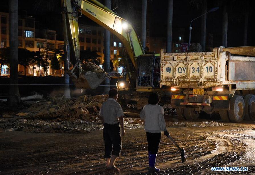 MAOMING, May 22, 2016 (Xinhua) -- An excavator works to clear silts in Xinyi, south China