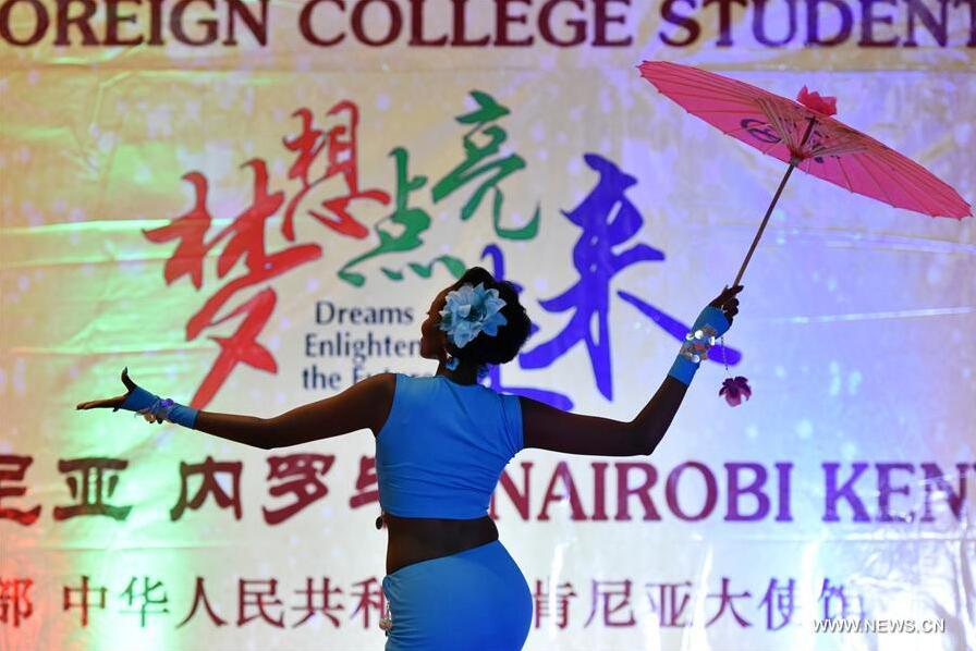 Ruth Wakuhi Kimani from Confucius Institute of Nairobi University performs a Chinese dance during the 15th Chinese Bridge Chinese Proficiency Competition for Foreign College Students Kenya Division in Nairobi, Kenya, May 23, 2016. With the theme "Dreams Enlighten the Future", the 15th Chinese Bridge Chinese Proficiency Competition for Foreign College Students Kenya Division was held in Nairobi. Ruth Wakuhi Kimani from Confucius Institute of Nairobi University won the contest and earned herself the ticket to the world final in China. [Photo: Xinhua/Sun Ruibo] 