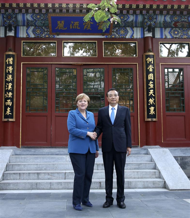 BEIJING, June 12, 2016 (Xinhua) -- Chinese Premier Li Keqiang (R) meets with German Chancellor Angela Merkel on her visit to China for the fourth round of China-Germany intergovernmental consultation in Beijing, capital of China, June 12, 2016. (Xinhua/Pang Xinglei)