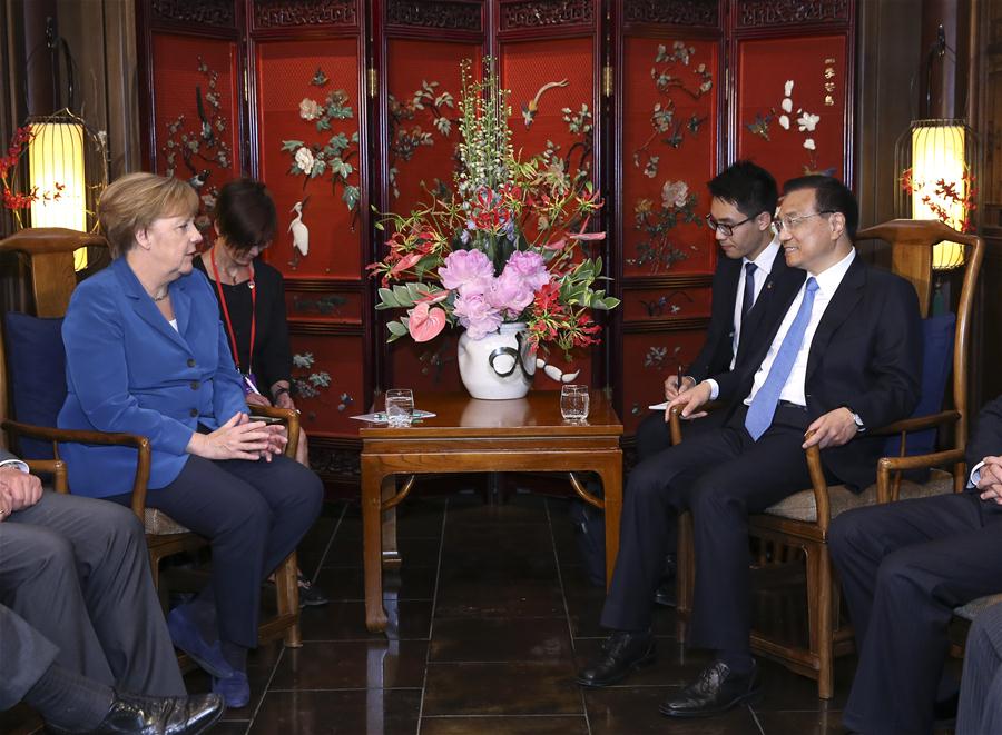 BEIJING, June 12, 2016 (Xinhua) -- Chinese Premier Li Keqiang (R) meets with German Chancellor Angela Merkel on her visit to China for the fourth round of China-Germany intergovernmental consultation in Beijing, capital of China, June 12, 2016. (Xinhua/Pang Xinglei)