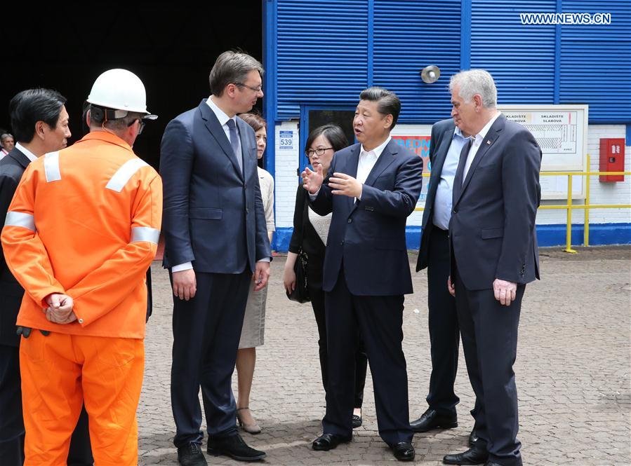 Chinese President Xi Jinping (2nd R, front), accompanied by Serbian President Tomislav Nikolic (1st R, front) and Serbian Prime Minister Aleksandar Vucic (3rd R, front), visits Serbia